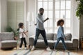 Full length African American father with kids dancing at home Royalty Free Stock Photo