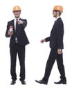 Full-length .architect in orange helmet with drawings for new project. Royalty Free Stock Photo