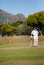 Full length of batsman standing on field during match Royalty Free Stock Photo