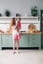 Mother having breakfast with her lovely daughter in the kitchen. Royalty Free Stock Photo