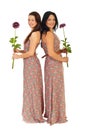 Full length of beautiful women with flowers Royalty Free Stock Photo