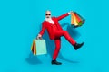 Full length body size photo aged man keeping bags shopping mall happy careless isolated vivid blue color background