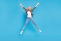 Full length body size photo amazed woman jumping up careless happy isolated pastel blue color background