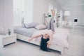 Full length body size photo beautiful she her little childish girl lying bed barefoot upside down curly wavy playful Royalty Free Stock Photo