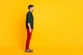 Full length body size photo of candid pensive indifferent man standing straight side profile looking into empty space Royalty Free Stock Photo