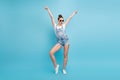 Full length body size photo of casual charming cute nice good girlfriend dancing alone isolated with blue background