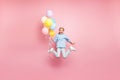 Full length body size photo of cheerfu positive cute nice screaming funny comic girl holding balloons with hands Royalty Free Stock Photo