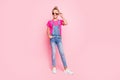 Full length body size photo of cheerful cute funny girl standing confidently in front of camera with hand in pocket Royalty Free Stock Photo