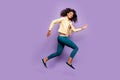 Full length body size photo of cheerful positive cute nice girl in pants trousers shirt yellow running jumping isolated Royalty Free Stock Photo