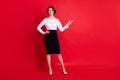 Full length body size photo curious business woman showing finger copyspace isolated vibrant red color background