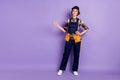 Full length body size photo curious woman engineer wearing cap overall pointing looking empty space pastel