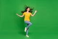 Full length body size photo dreamy girl brunette hair dancing at party enjoying music isolated vivid green color