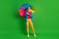 Full length body size photo of girl with bob hair keeping colorful umbrella wearing autumn clothes  on bright Royalty Free Stock Photo