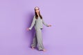 Full length body size photo of girl in grey pajama sleeping mask smiling cheerful isolated pastel purple color