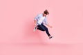 Full length body size photo of jumping high crazy he his him handsome holding imagine electric guitar in hands trying Royalty Free Stock Photo