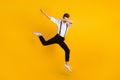 Full length body size photo of jumping man dancing hip-hop showing hype dab sign isolated on bright yellow color