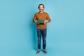 Full length body size photo middle-aged bearded man smiling keeping book pile teacher professor isolated on vivid blue