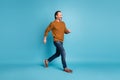 Full length body size photo middle-aged bearded man smiling stepping hurrying in stylish clothes isolated on bright blue
