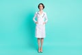 Full length body size photo of nurse serious wearing glasses isolated on vivid turquoise color background