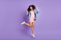 Full length body size photo overjoyed gesturing like winner in short dress isolated pastel violet color background