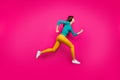 Full length body size photo of pretty cute nice sweet girl running towards shopping senter in footwear yellow pants Royalty Free Stock Photo