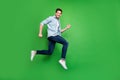 Full length body size photo side profile of running jumping ecstatic man wearing white sneakers smiling toothily urgent Royalty Free Stock Photo