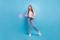 Full length body size photo smiling girl wearing casual outfit keeping net looking copyspace isolated pastel blue color Royalty Free Stock Photo