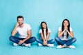 Full length body size photo of white nice cheerful charming family wearing denim sitting with legs crossed while Royalty Free Stock Photo