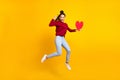 Full length body size photo woman showing red heart jumping isolated vibrant blue color background