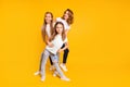 Full length body size portrait of three nice cute lovely attractive cheerful cheery positive funny people having fun Royalty Free Stock Photo