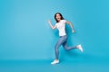 Full length body size profile side view of nice active sportive slim fit skinny cheerful cheery girl jumping running