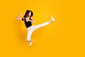 Full length body size side profile photo of woman jumping beating punching leg like karate fighter vibrant