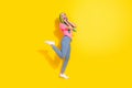 Full length body size view of attractive cheerful amazed delighted girl having fun isolated over bright color background