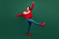 Full length body size view of attractive cheerful ecstatic girl dancing fooling isolated over green color background