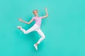 Full length body size view of attractive cheerful flexible sportive girl jumping dancing isolated over teal turquoise