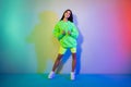 Full length body size view of attractive cool cheerful girl posing isolated over multicolor vivid neon light background