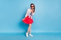 Full length body size view of attractive flirty girl posing sending air kiss amour date isolated over bright blue color