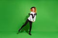 Full length body size view of attractive girlish funky cheerful girl fooling dancing isolated over bright green color