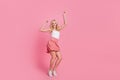Full length body size view of attractive thin cheerful girl dancing moving rest isolated over pink pastel color