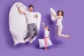 Full length body size view of cheerful glad carefree funny family small little daughter jumping having fun bedtime Royalty Free Stock Photo