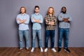 Full length body size view of four nice attractive serious cool guys wearing casual shirt folded arms isolated over gray