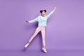 Full length body size view of her she nice attractive slim cheerful crazy girl jumping holding invisible parasol windy Royalty Free Stock Photo