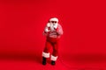 Full length body size view of his he handsome bearded fat overweight cool talented Santa vocalist rock roll star singing