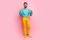 Full length body size view of his he nice attractive cheerful cheery funky guy wearing mint shirt yellow pants clothes Royalty Free Stock Photo