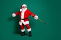 Full length body size view of his he nice attractive cheerful cheery Santa holding in hand cane having fun dancing