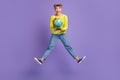 Full length body size view of lovely cheerful girl jumping holding in hand globe subject having fun isolated on violet