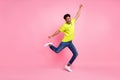 Full length body size view of nice attractive best cheerful guy dancing celebrating over pink pastel color