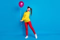 Full length body size view of nice attractive delighted shy cheerful cheery girl circus clown holding in hand helium Royalty Free Stock Photo