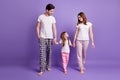 Full length body size view of nice cheerful careful lovely family mom dad offspring daughter wearing sleepwear going bed Royalty Free Stock Photo