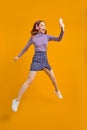 Full length body size view of nice cheerful cheery woman in headhones jumping Royalty Free Stock Photo